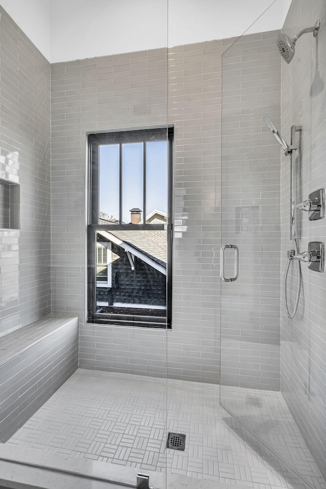 bathroom featuring an enclosed shower