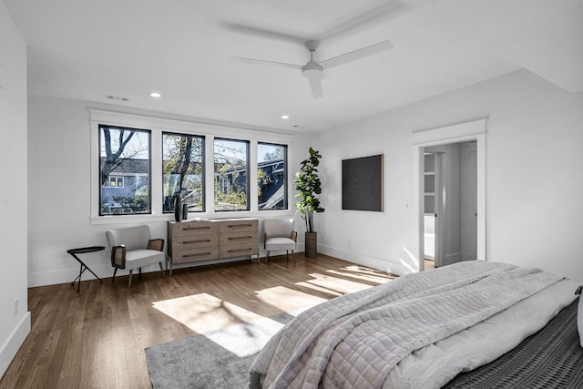 bedroom with dark hardwood / wood-style floors and ceiling fan