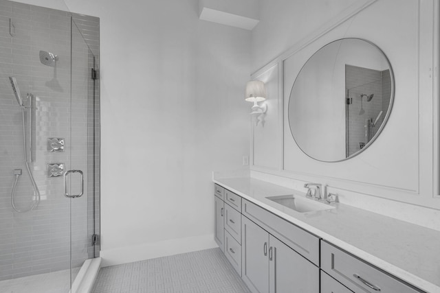 bathroom featuring tile patterned flooring, vanity, and an enclosed shower