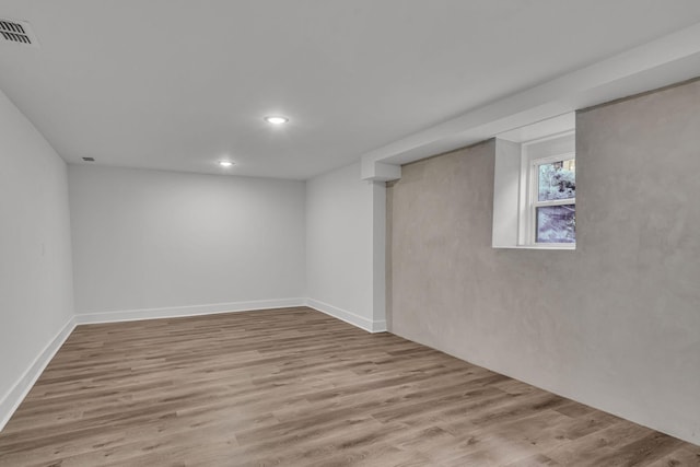 basement featuring light hardwood / wood-style flooring