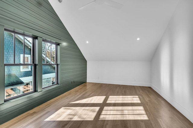 bonus room featuring hardwood / wood-style floors and vaulted ceiling