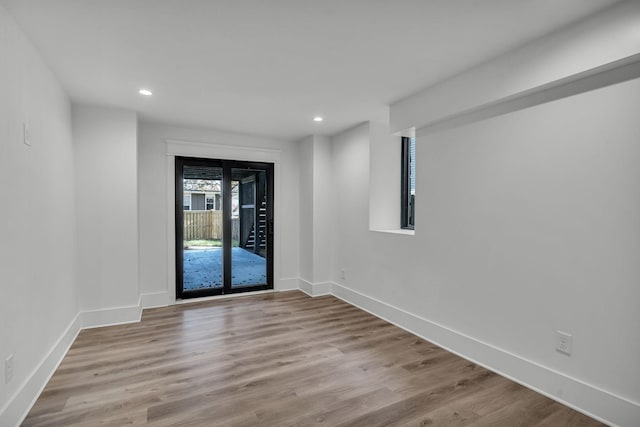 empty room with light hardwood / wood-style floors