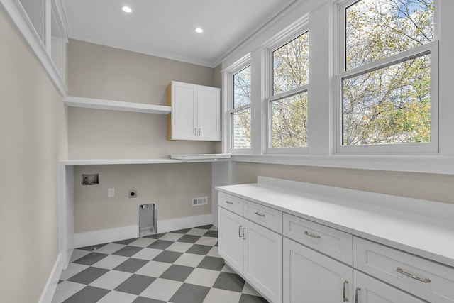 washroom with cabinets, washer hookup, and electric dryer hookup