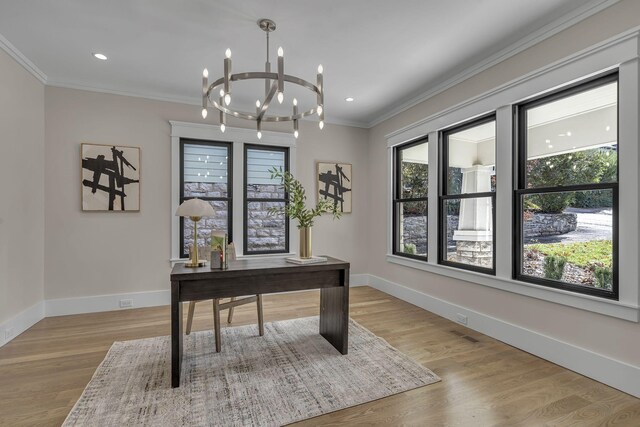 home office with light hardwood / wood-style flooring, an inviting chandelier, and ornamental molding