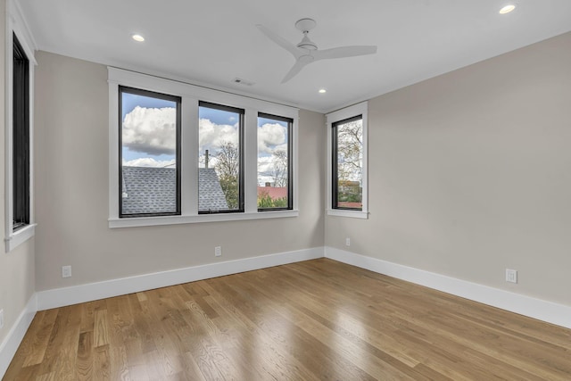 unfurnished room featuring light hardwood / wood-style flooring and ceiling fan