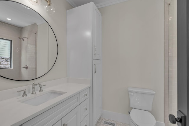 bathroom featuring vanity, a shower, tile patterned floors, crown molding, and toilet