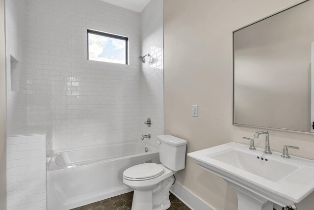 full bathroom featuring tile patterned flooring,  shower combination, toilet, and sink