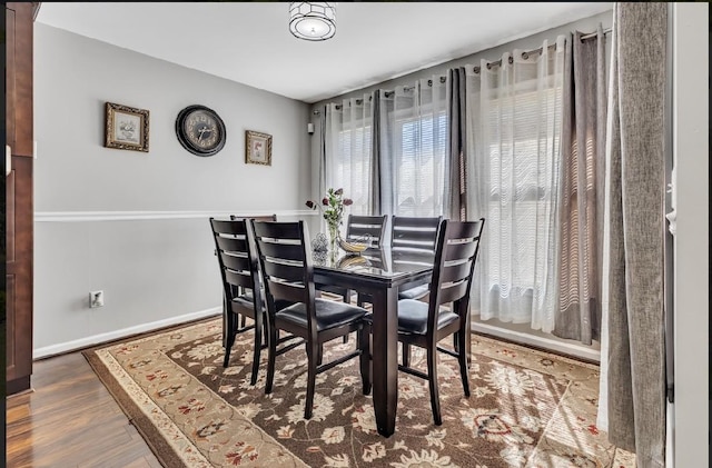 dining area with hardwood / wood-style flooring