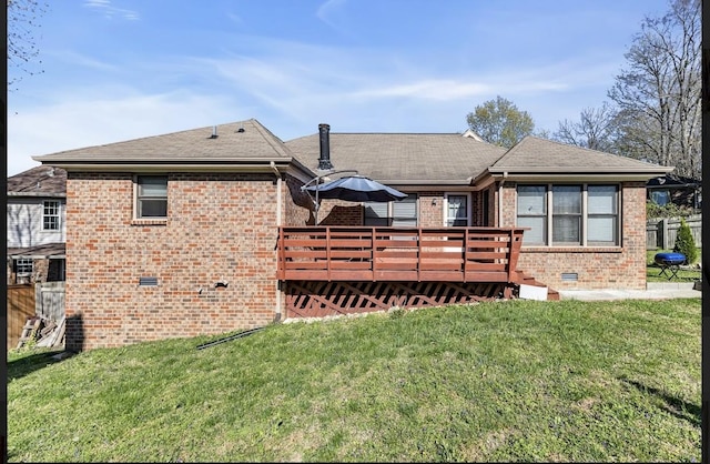 back of house with a deck and a lawn