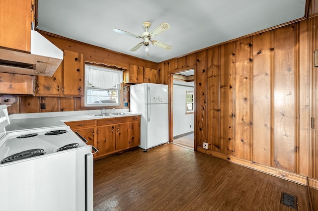 kitchen with white appliances, exhaust hood, sink, ceiling fan, and dark hardwood / wood-style floors