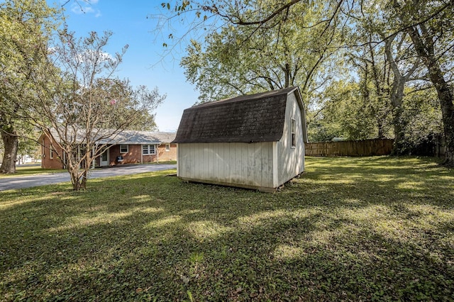 view of outbuilding with a yard