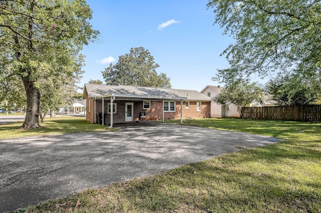 rear view of property with a lawn