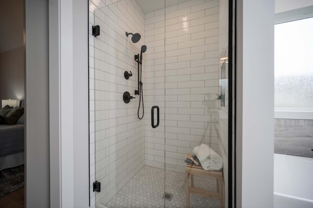 bathroom featuring a shower with door