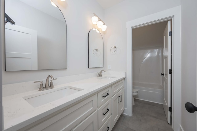 full bathroom featuring bathing tub / shower combination, vanity, and toilet