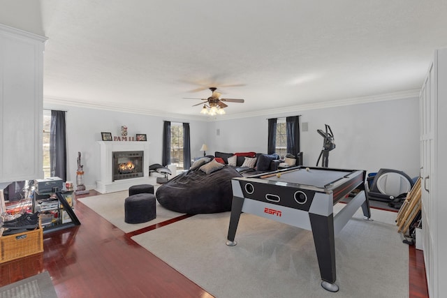 recreation room with crown molding, hardwood / wood-style floors, ceiling fan, and billiards