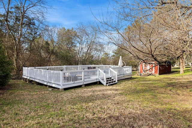 view of yard with a shed and a deck