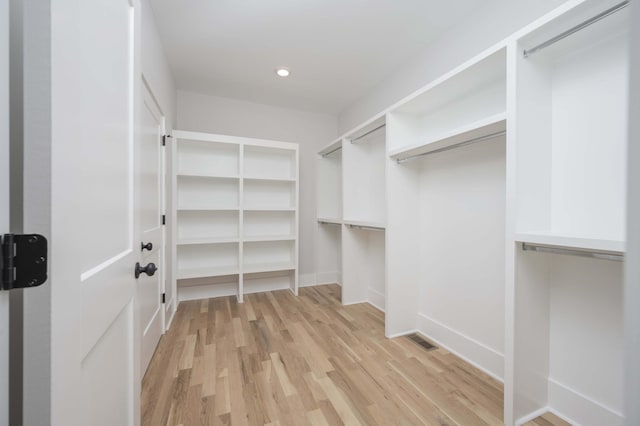 walk in closet featuring light wood-type flooring