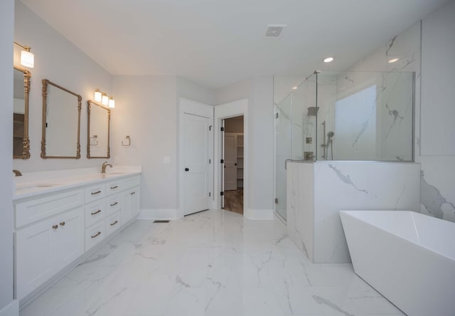 bathroom with vanity and independent shower and bath