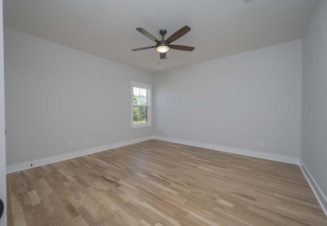 unfurnished room with ceiling fan and light wood-type flooring