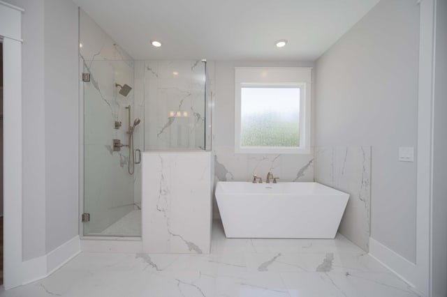 bathroom with separate shower and tub