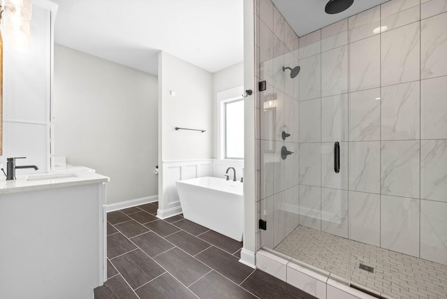 bathroom featuring vanity and plus walk in shower