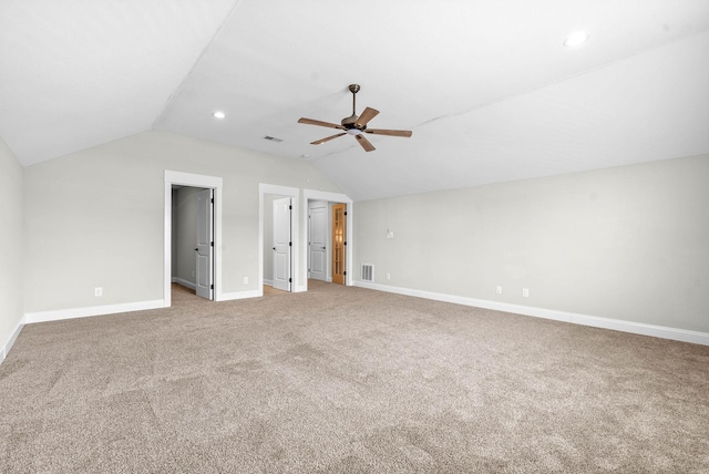 bonus room with light carpet, vaulted ceiling, and ceiling fan