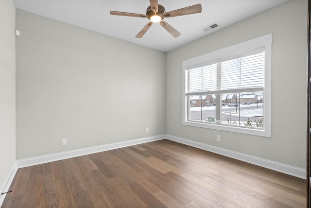 unfurnished room featuring ceiling fan and hardwood / wood-style floors