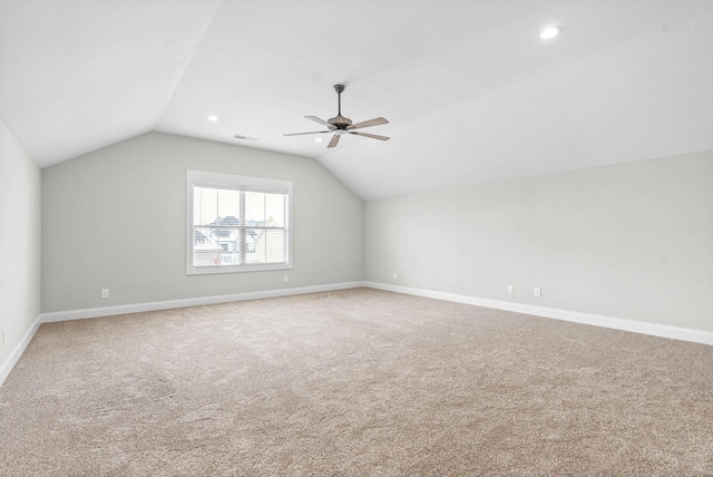 additional living space with carpet flooring, ceiling fan, and lofted ceiling