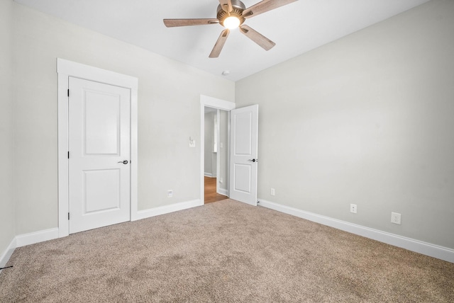 unfurnished bedroom featuring carpet and ceiling fan