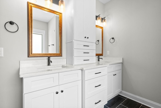 bathroom with tile patterned floors and vanity