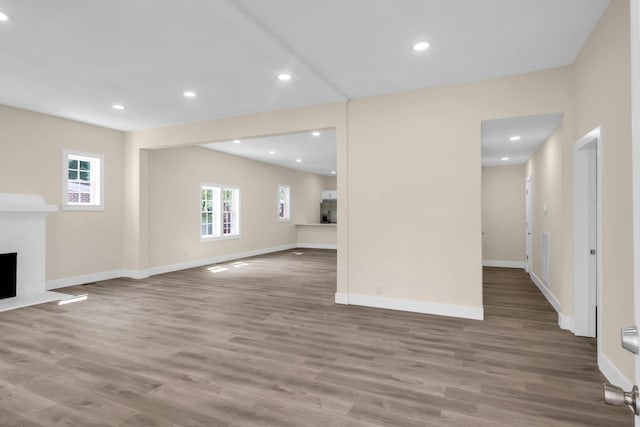 unfurnished living room with hardwood / wood-style floors