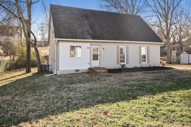 cape cod home with a front lawn