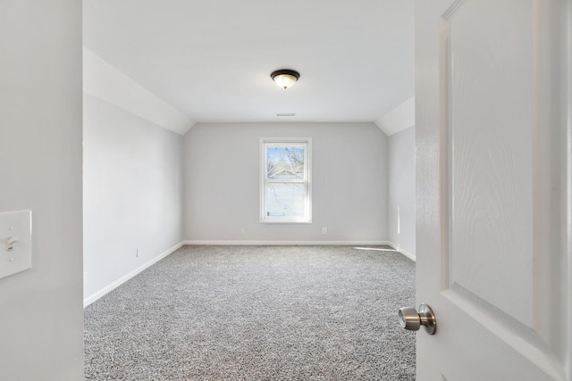 bonus room with carpet flooring and lofted ceiling