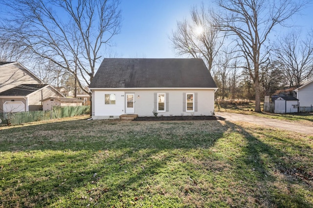 new england style home featuring a front lawn