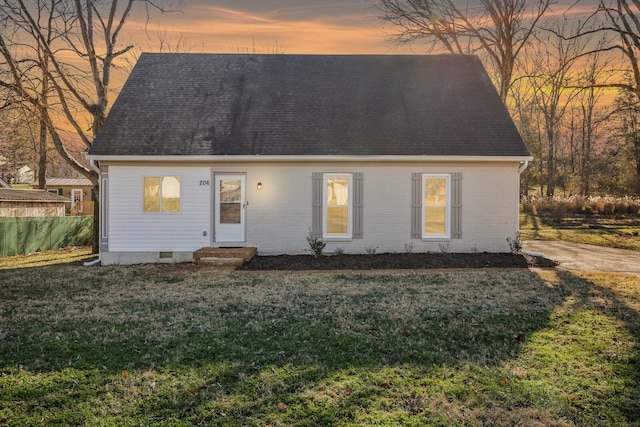 new england style home with a yard