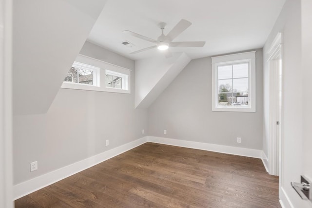 bonus room featuring dark hardwood / wood-style floors, ceiling fan, and lofted ceiling