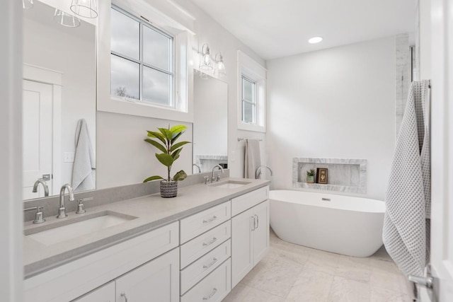 bathroom featuring vanity and a bathtub