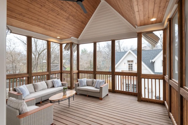 sunroom / solarium with ceiling fan, wood ceiling, and vaulted ceiling