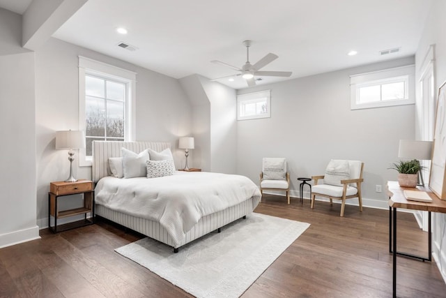 bedroom featuring multiple windows, ceiling fan, and dark wood-type flooring