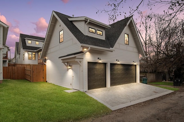 exterior space featuring a yard and a garage