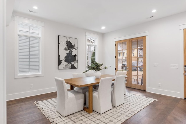 dining room featuring hardwood / wood-style flooring and french doors