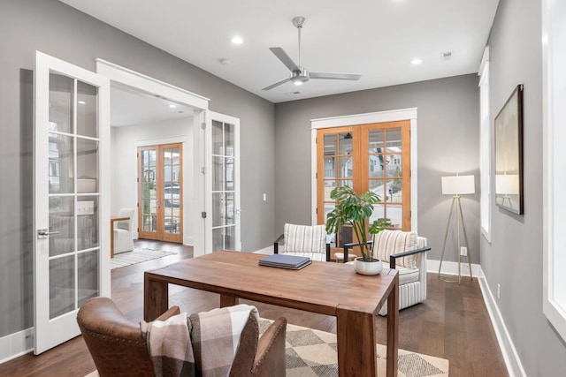 home office with french doors, dark hardwood / wood-style floors, and ceiling fan