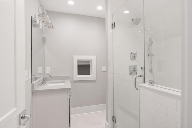 bathroom featuring vanity and walk in shower