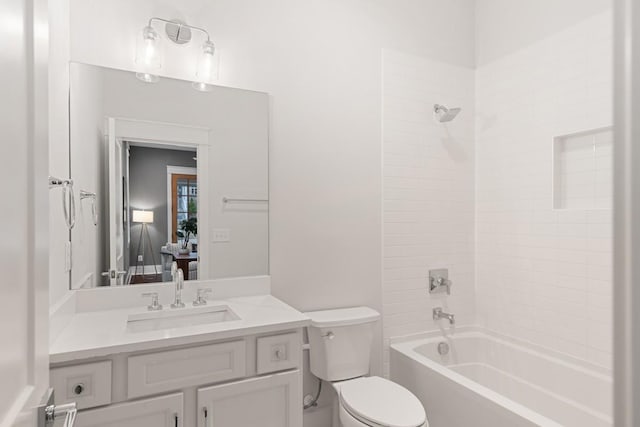 full bathroom with vanity, toilet, and washtub / shower combination