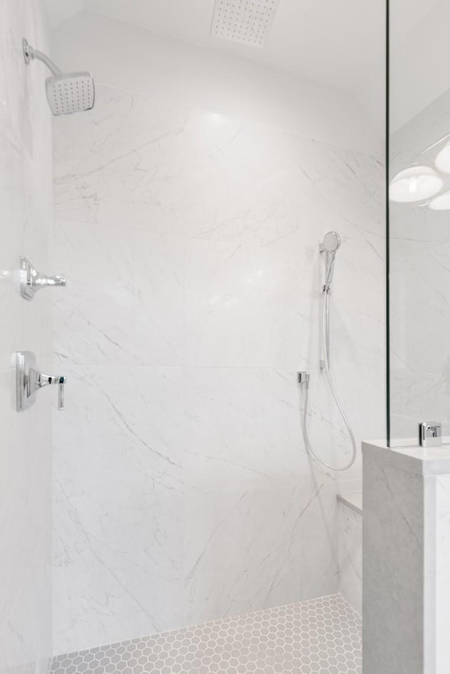 bathroom with a tile shower