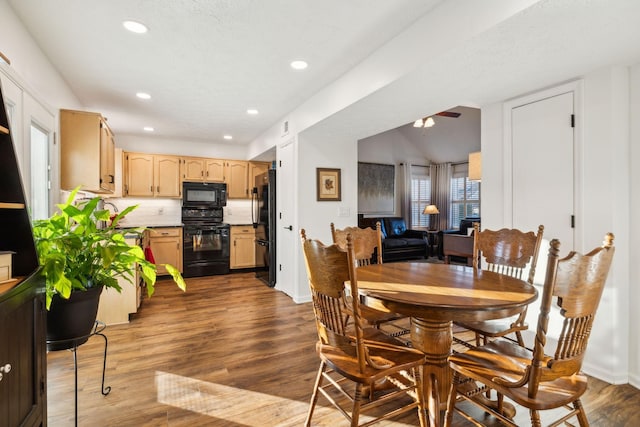 dining area with dark hardwood / wood-style flooring