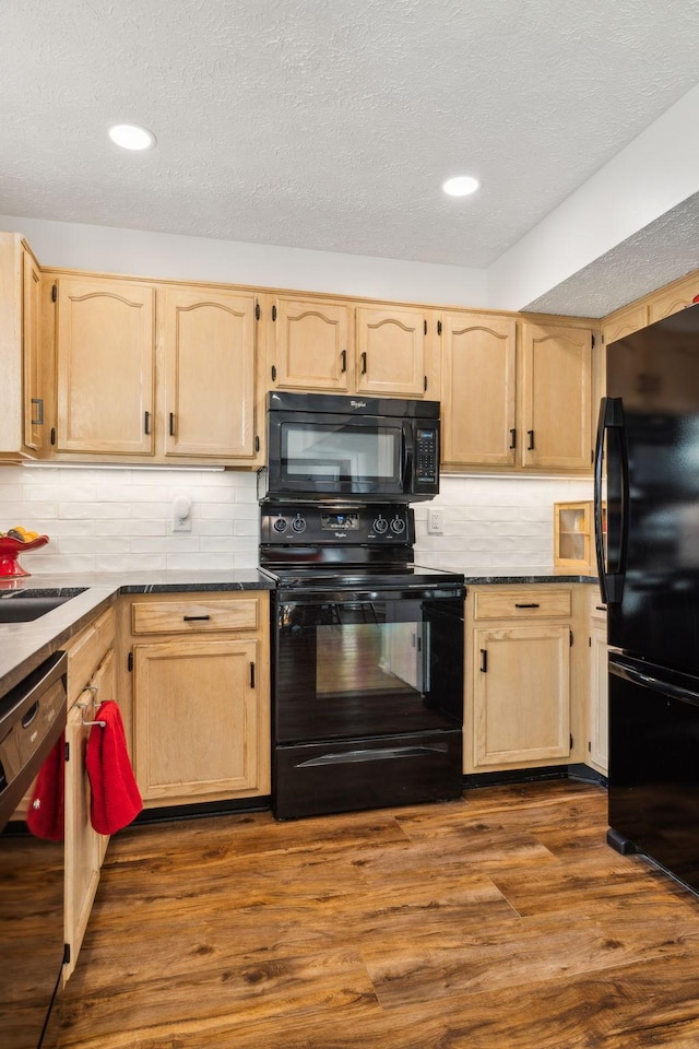 kitchen featuring black appliances, dark hardwood / wood-style floors, and light brown cabinetry