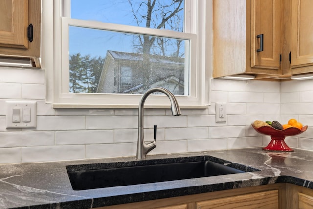 interior details with sink and tasteful backsplash