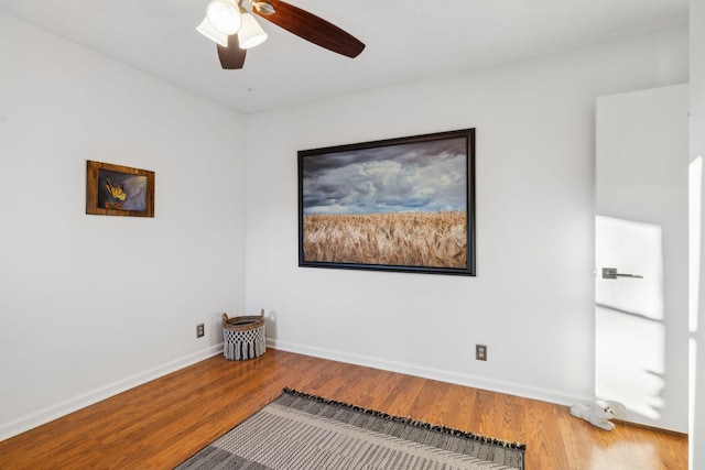 spare room featuring hardwood / wood-style flooring and ceiling fan