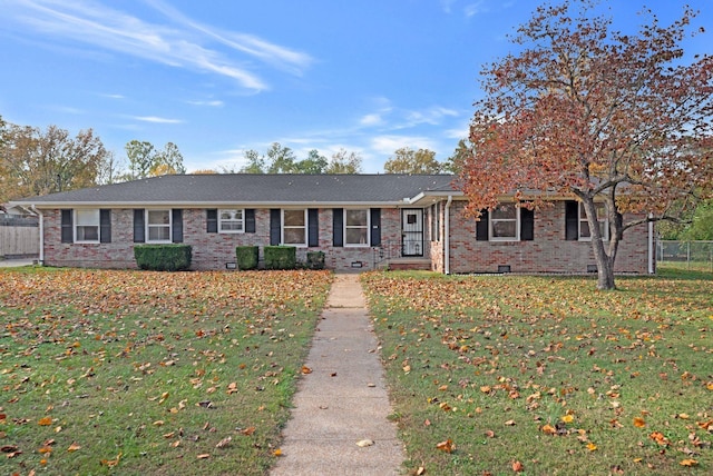 ranch-style house with a front lawn